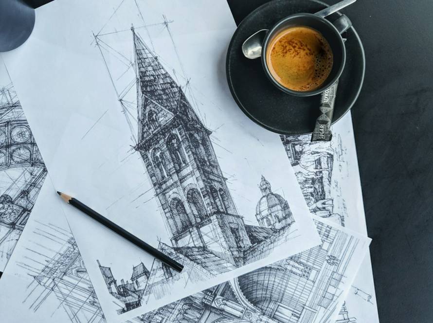Coffee mug beside a sketch on paper, planning a renovation