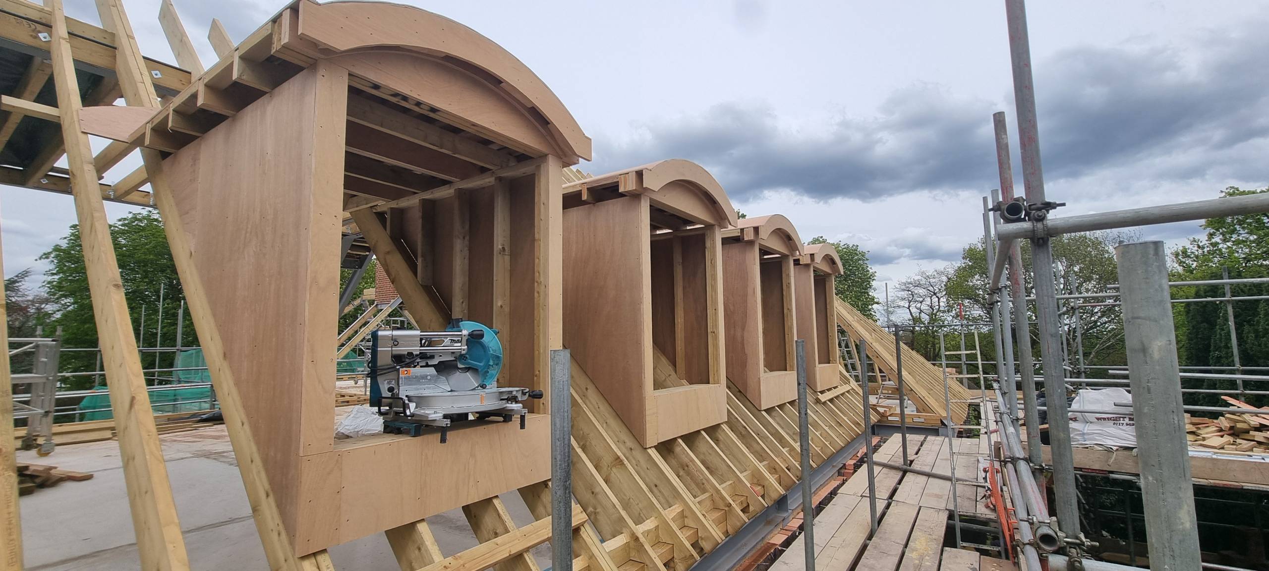 Row of finished round dormer frames on the roof, Northampton